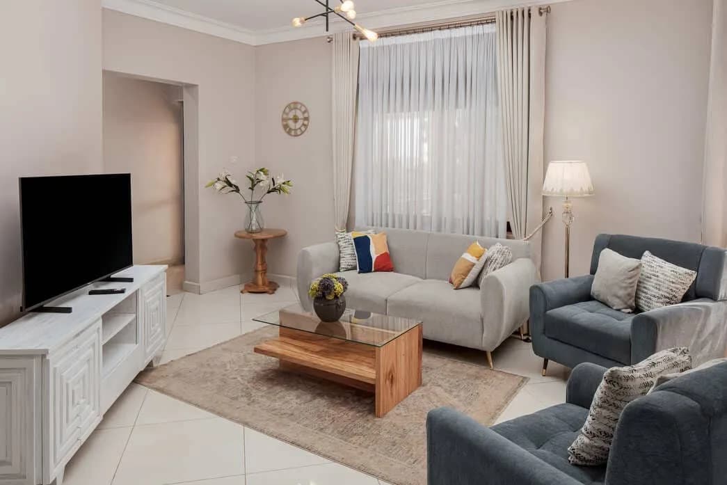 Iotaville furnished living room with sofas and flat-screen TV